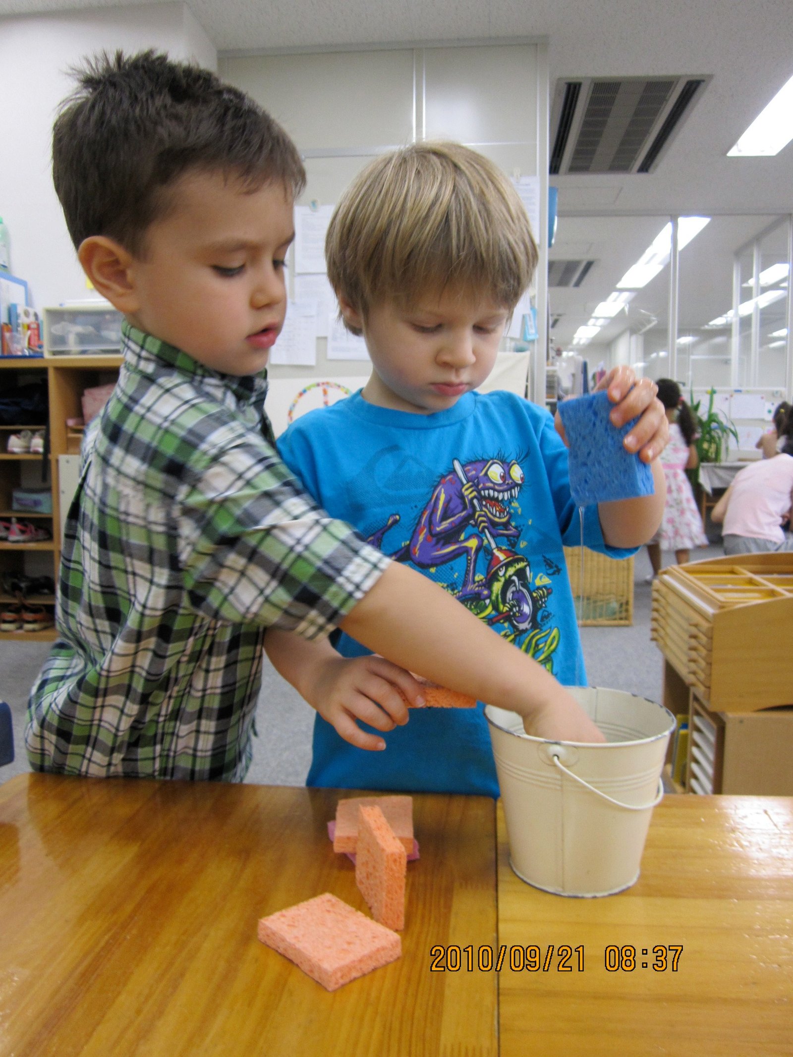 Children folding cloths