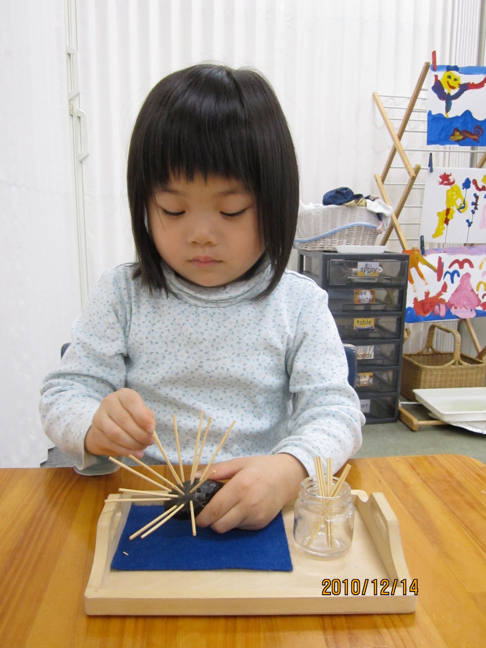 Child transferring with a spoon