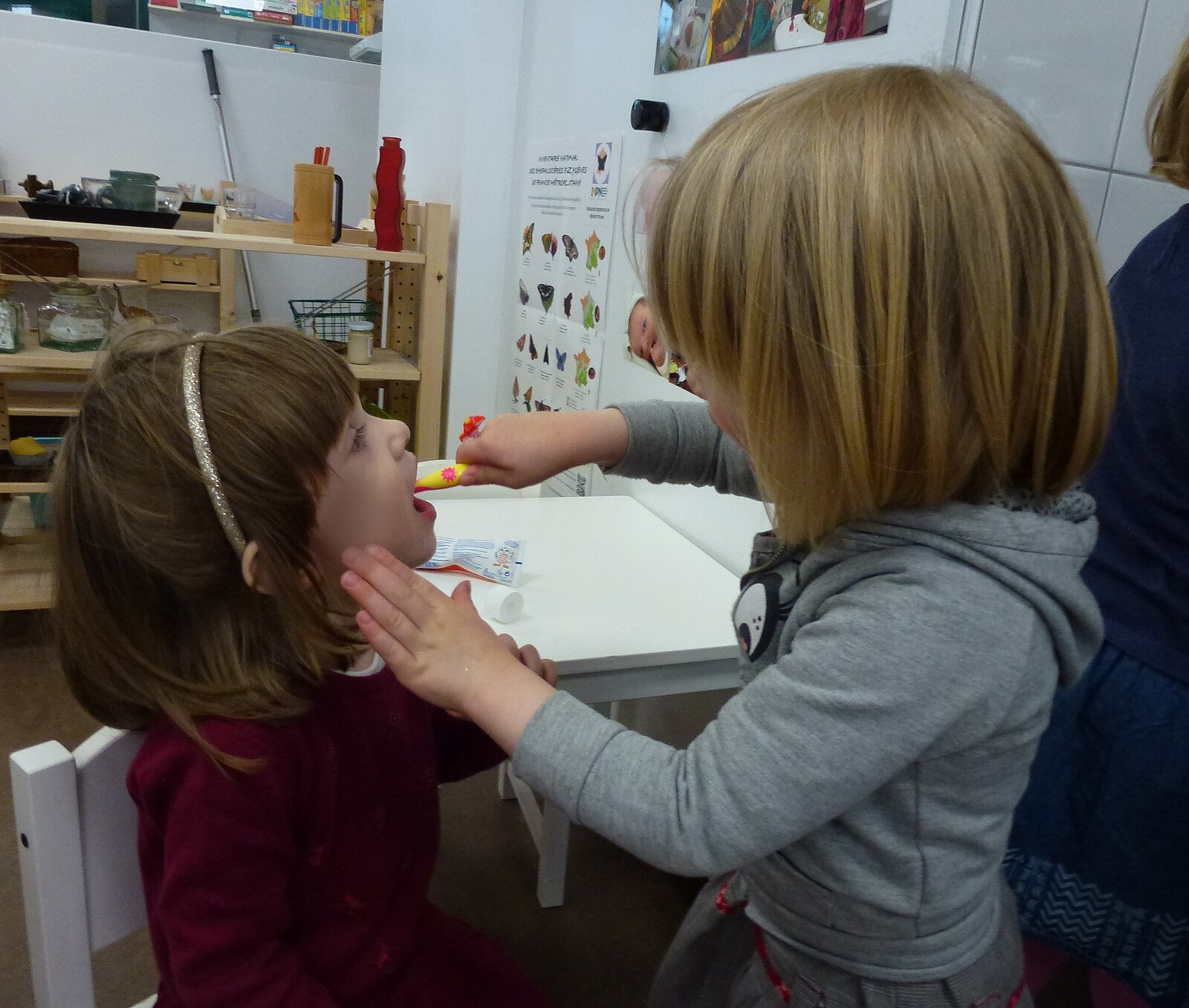 Children with a teeth model
