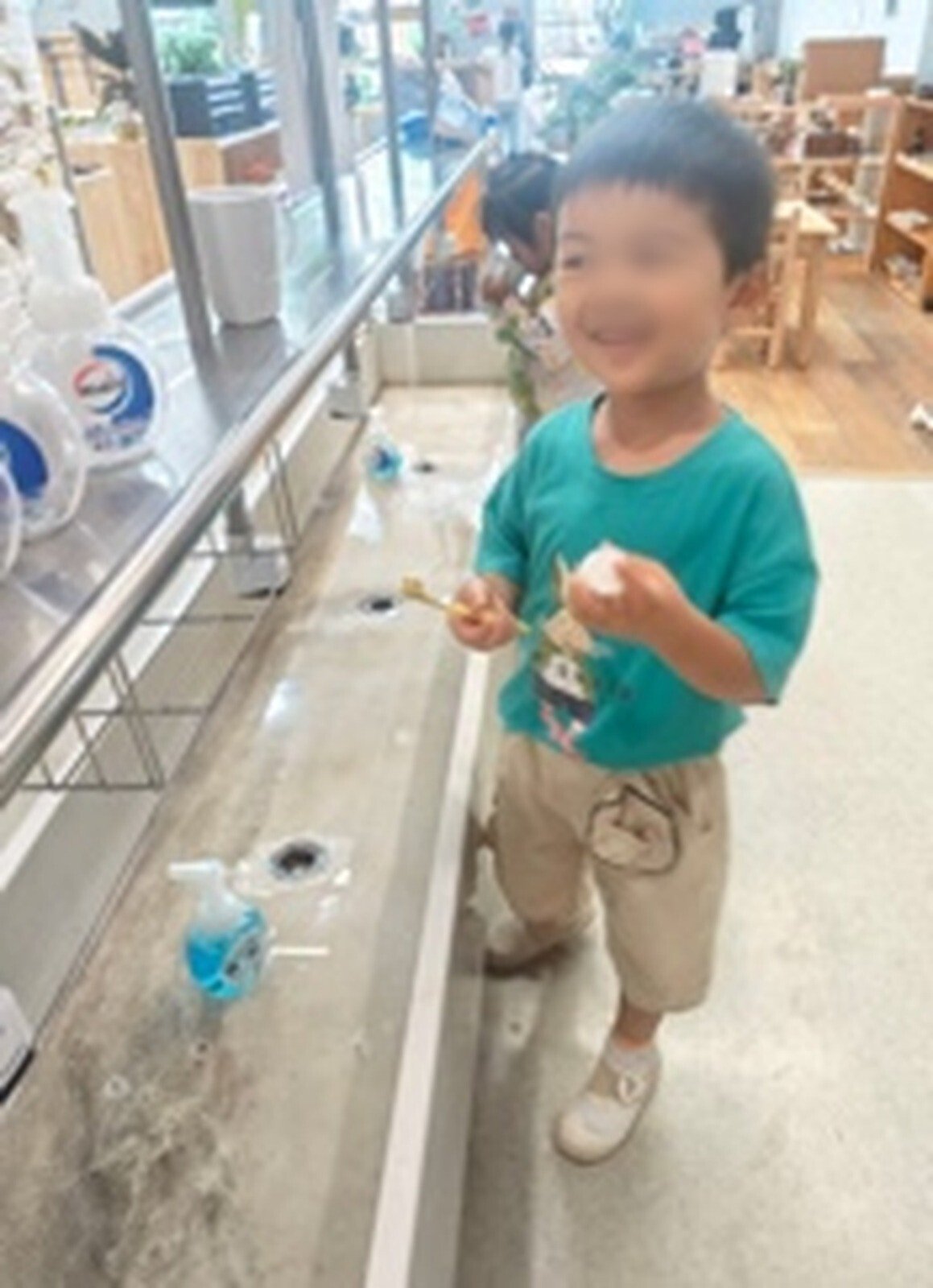Child at a bathroom sink