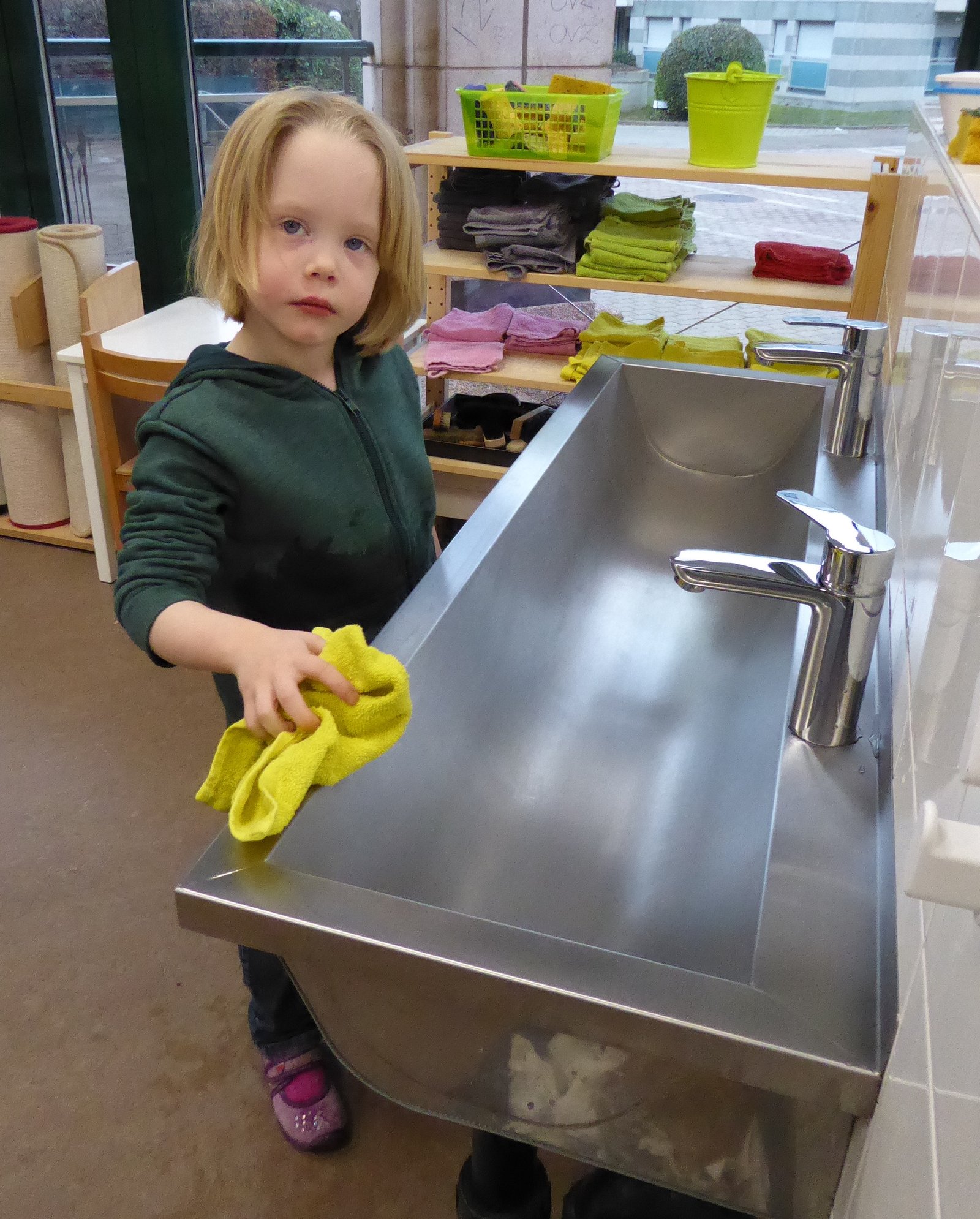 Two children at a hexagonal mirror