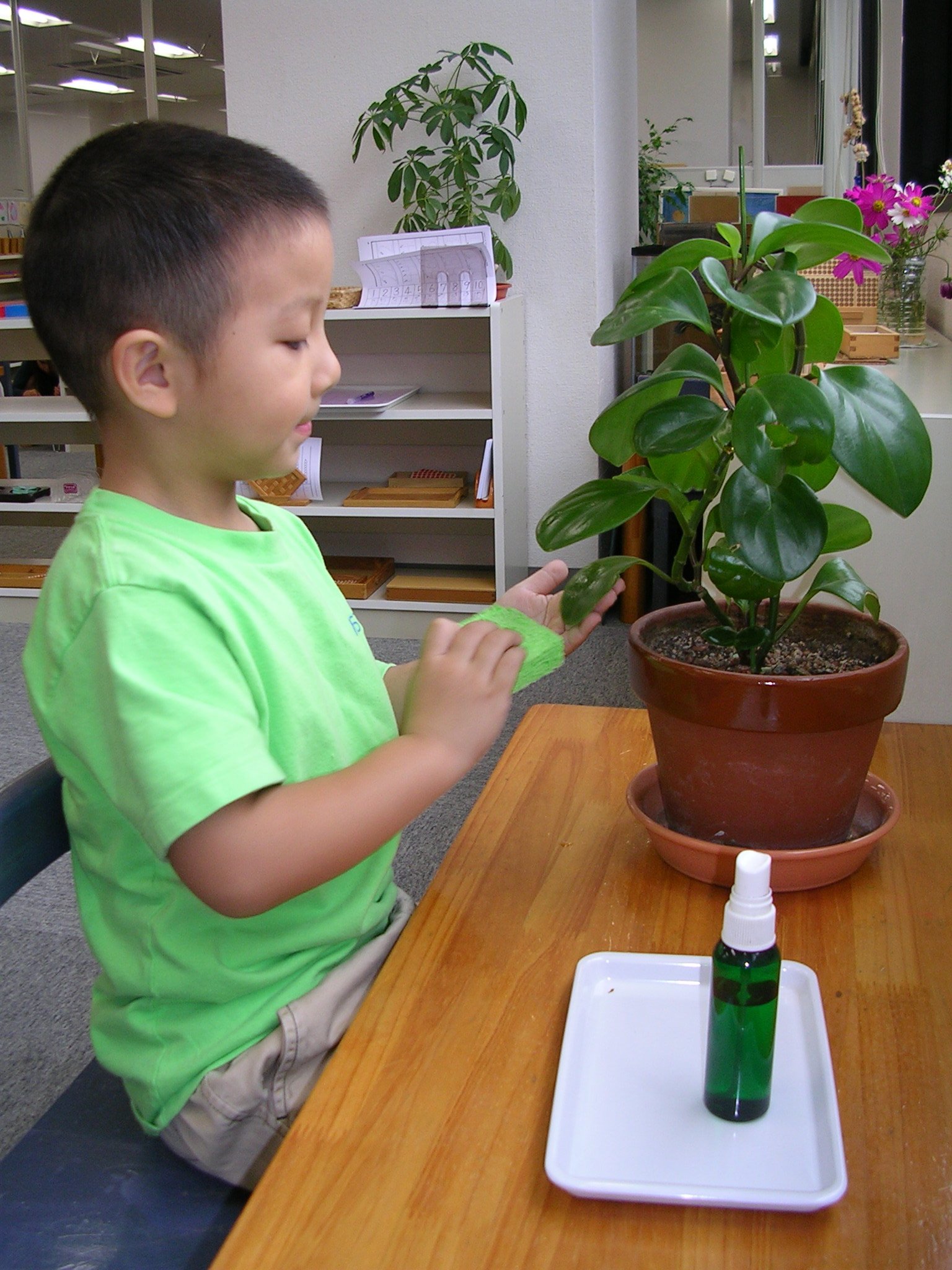 Children at a table with a mirror