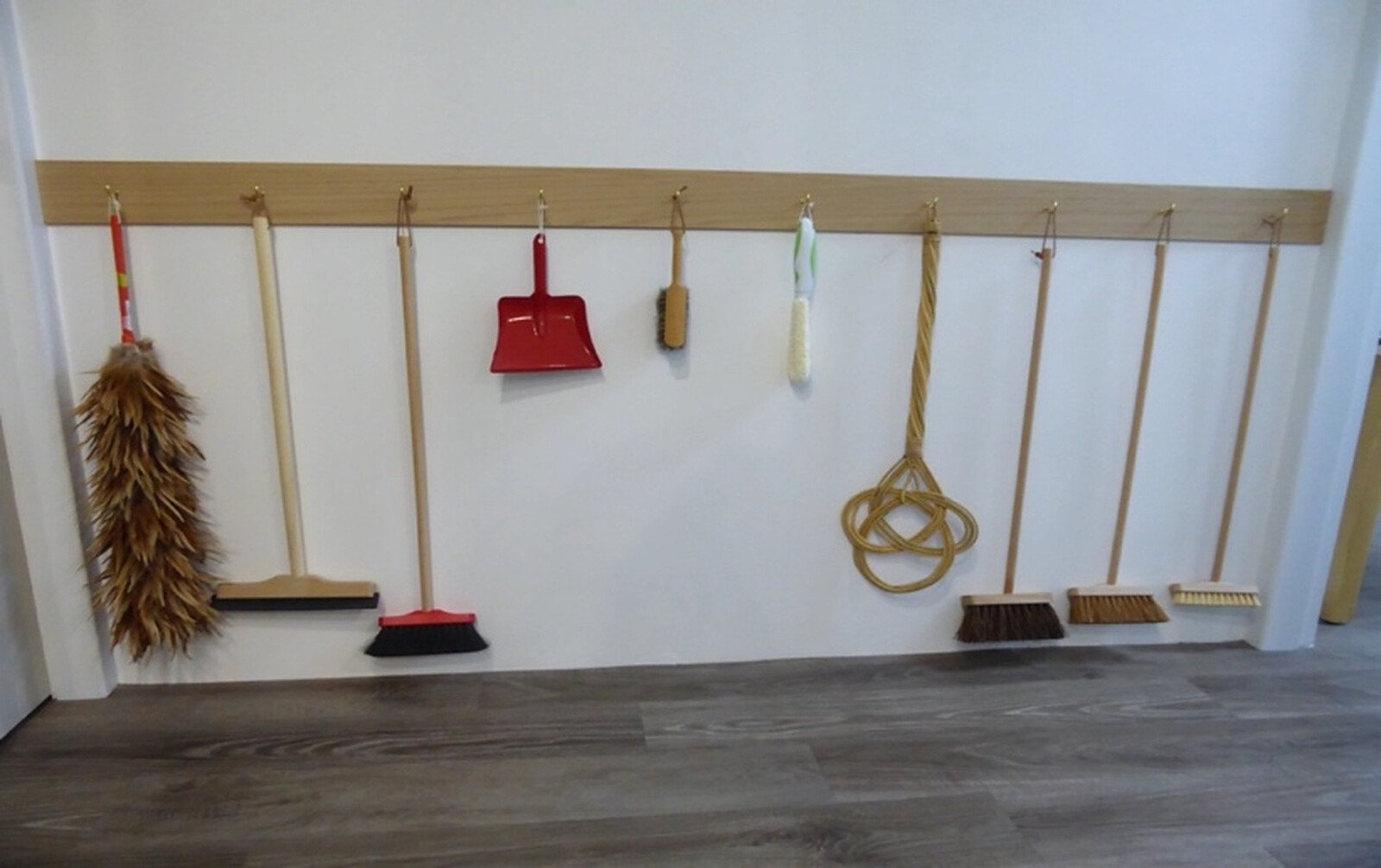 Brooms and tools on a wall